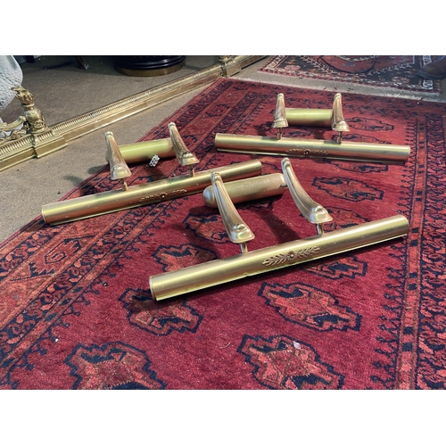 53 - Set of three brass wall picture lights {25cm  H  x 62cm W x 24cm D}.