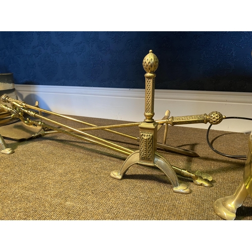 55 - Edwardian brass fire companion set and fire dogs {26cm  H  x 72cm W x 21cm D}.