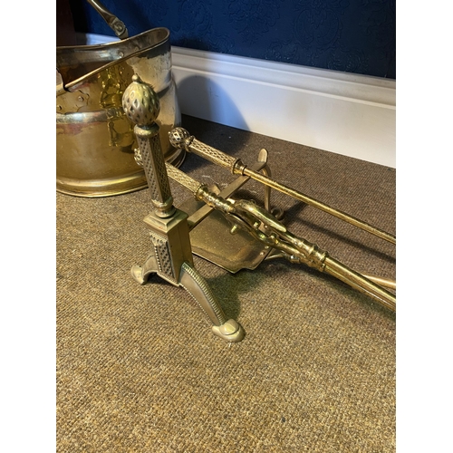 55 - Edwardian brass fire companion set and fire dogs {26cm  H  x 72cm W x 21cm D}.