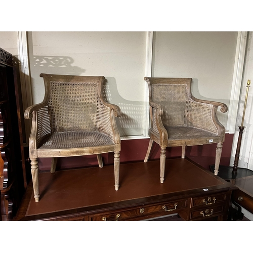 617 - Pair of Regency mahogany and Berger armchairs raised on reeded legs {86cm  H  x 64cm W x 50cm D}.