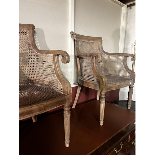 617 - Pair of Regency mahogany and Berger armchairs raised on reeded legs {86cm  H  x 64cm W x 50cm D}.