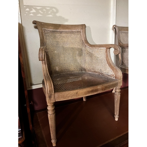 617 - Pair of Regency mahogany and Berger armchairs raised on reeded legs {86cm  H  x 64cm W x 50cm D}.