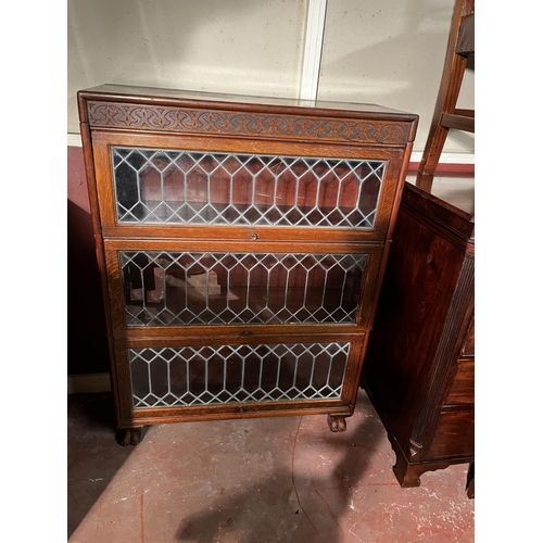 623 - Art Deco oak stackable bookshelf with sliding leaded glass doors {118cm  H  x 87cm W x 32cm D}.