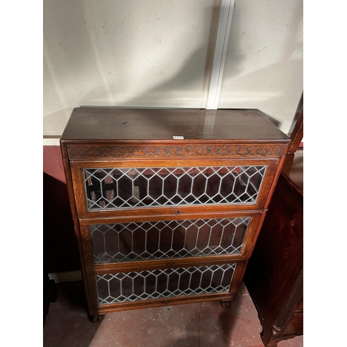 623 - Art Deco oak stackable bookshelf with sliding leaded glass doors {118cm  H  x 87cm W x 32cm D}.