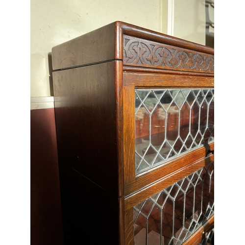 623 - Art Deco oak stackable bookshelf with sliding leaded glass doors {118cm  H  x 87cm W x 32cm D}.