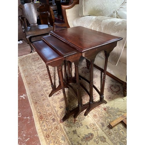 627 - 19th C. mahogany nest of three tables raised on turned legs {72cm  H  x 56cm W x 36cm D}.