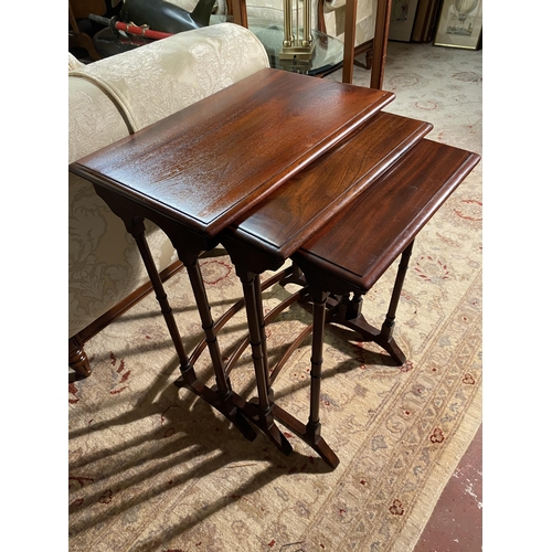 627 - 19th C. mahogany nest of three tables raised on turned legs {72cm  H  x 56cm W x 36cm D}.