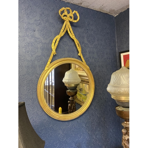 63 - Pair of good quality Regency giltwood pier mirrors decorated with bows and swags {107cm  H  x 60cm W... 