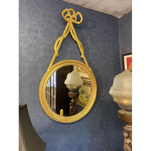 63 - Pair of good quality Regency giltwood pier mirrors decorated with bows and swags {107cm  H  x 60cm W... 