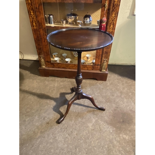 80 - Edwardian mahogany wine table raised on turned column and three outwept feet {63cm  H  x 38cm Dia.}.