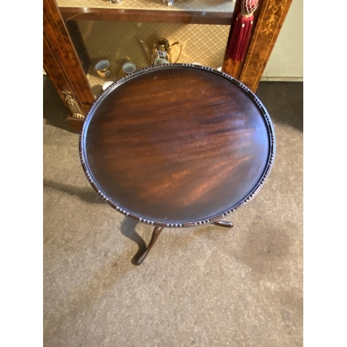 80 - Edwardian mahogany wine table raised on turned column and three outwept feet {63cm  H  x 38cm Dia.}.