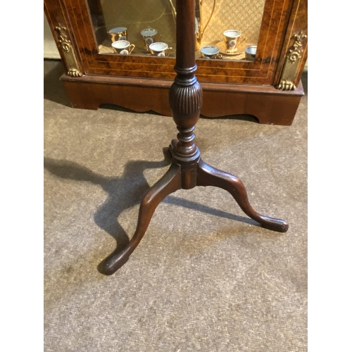 80 - Edwardian mahogany wine table raised on turned column and three outwept feet {63cm  H  x 38cm Dia.}.