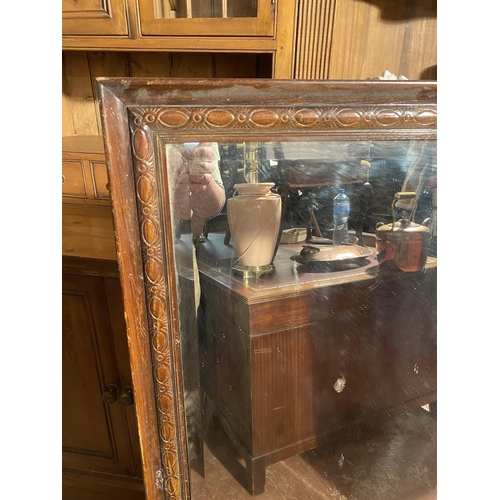 860 - Edwardian oak framed wall mirror {127cm  H  x 90cm W}.