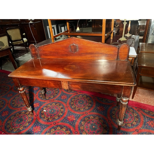 888 - 19th C. mahogany side table with gallery back raised on turned legs {104cm  H  x 133cm W x 53cm D}.