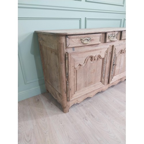 99 - 19th C. bleached oak side cabinet with three drawers in frieze above two blind doors {91 cm H x 153 ... 