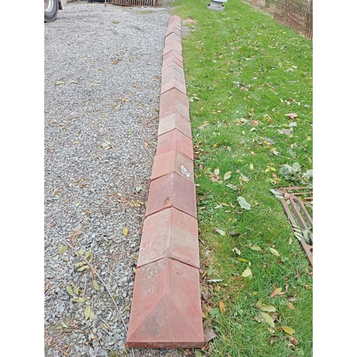 873 - Collection of twenty five terracotta wall copings with two ends{w 770 H 13cm x d 28cm}.