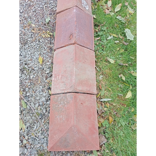 873 - Collection of twenty five terracotta wall copings with two ends{w 770 H 13cm x d 28cm}.