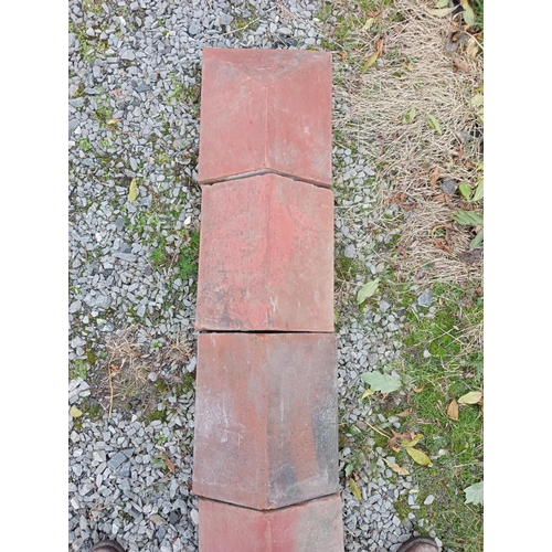 873 - Collection of twenty five terracotta wall copings with two ends{w 770 H 13cm x d 28cm}.