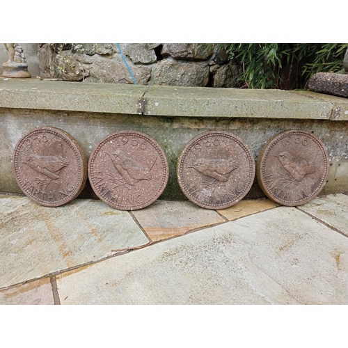 887 - Set of four composition stone coins depicting a farthing with wren bird {Dia 31cm x D 3cm }.