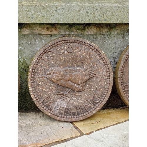 887 - Set of four composition stone coins depicting a farthing with wren bird {Dia 31cm x D 3cm }.