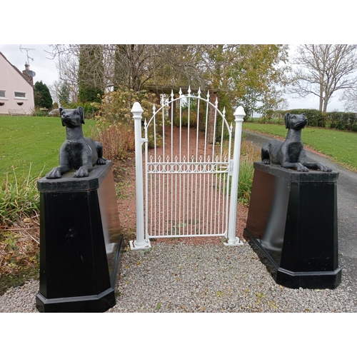 893 - Pair of cast iron dogs and bases {H 163cm x W 64cm x D 145cm Dogs H 66cm x W 46cm x W 126cm }.