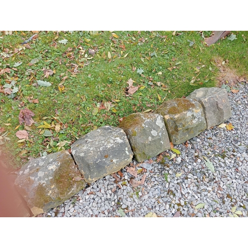 905 - Set of ten sandstone wall copings triangular form{H 16cm x D 30cm x W  292cm }.