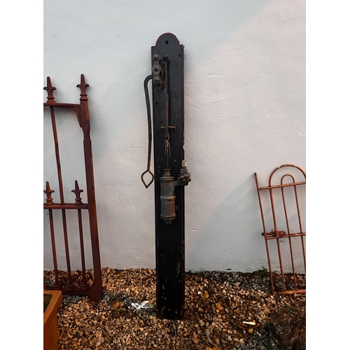 926 - Early 20th C. wrought iron yard water pump mounted on wooden plaque {170 cm H x 30 cm Dia.}.