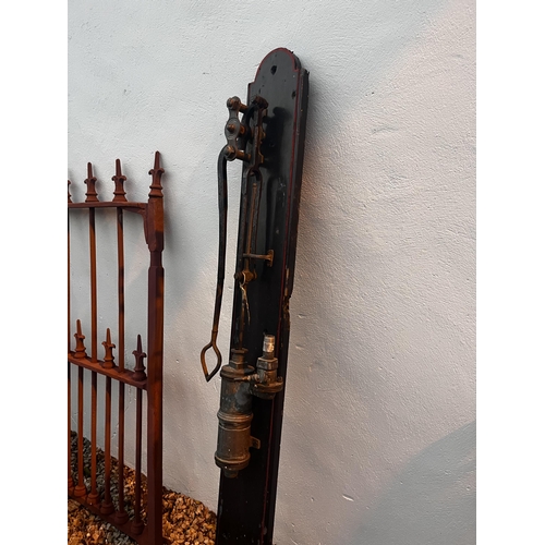 926 - Early 20th C. wrought iron yard water pump mounted on wooden plaque {170 cm H x 30 cm Dia.}.