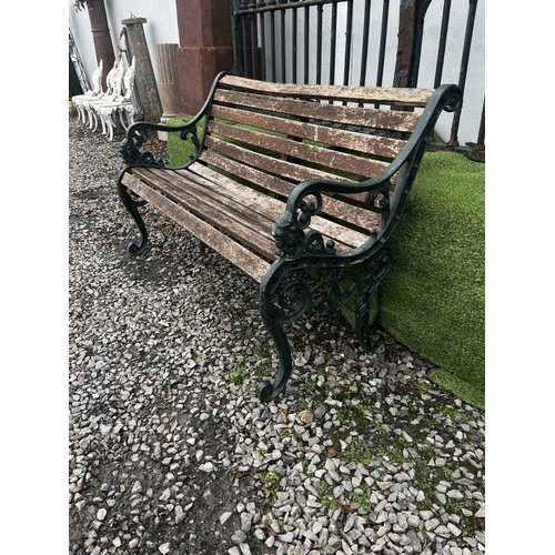 934 - Cast alloy garden bench with wooden slats {80 cm H x 126 cm W x 80 cm D}.