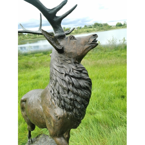 877 - Exceptional life size bronze model of Stag on craggy rock. {230 cm H x 150 cm W x 60 cm D}.