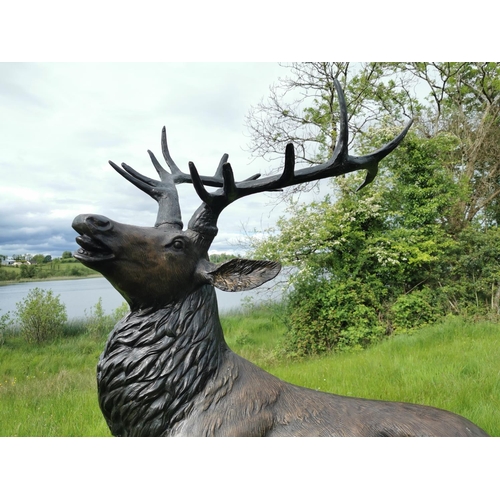 877 - Exceptional life size bronze model of Stag on craggy rock. {230 cm H x 150 cm W x 60 cm D}.