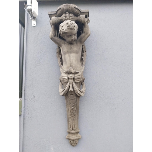 871 - Pair of decorative composition wall corbels depicting cherubs {125 cm H x 38 cm W x 30 cm D}.