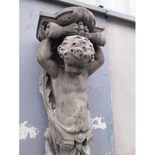 871 - Pair of decorative composition wall corbels depicting cherubs {125 cm H x 38 cm W x 30 cm D}.