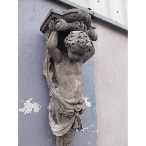 871 - Pair of decorative composition wall corbels depicting cherubs {125 cm H x 38 cm W x 30 cm D}.