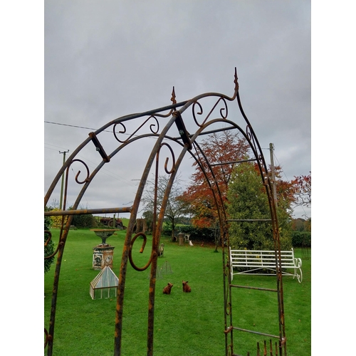 894A - Wrought iron rose arch with double gate {239 cm H x 133 cm W x 36 cm D}.