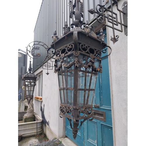 896A - Pair of decorative wrought iron wall hanging lights with brackets {205 cm H x 43 cm W x 100 cm D}.