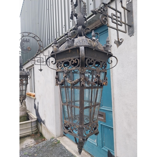 896A - Pair of decorative wrought iron wall hanging lights with brackets {205 cm H x 43 cm W x 100 cm D}.