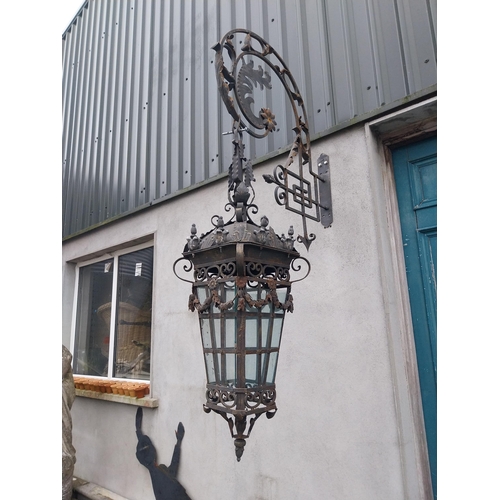 896A - Pair of decorative wrought iron wall hanging lights with brackets {205 cm H x 43 cm W x 100 cm D}.