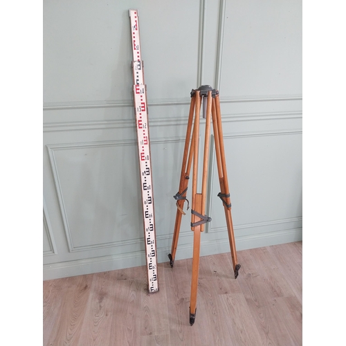 410 - Early 20th C. theodolite stand and measuring stick.