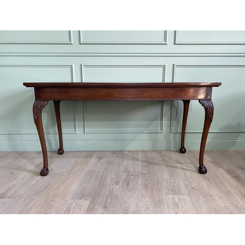 377 - Edwardian mahogany console table raised on carved cabriole legs {87 cm H x 168 cm W x 69 cm D}.