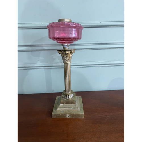 392 - 19th C. brass Corinthian column oil lamp base ruby glass bowl {46 cm H x 16 cm Dia.}.