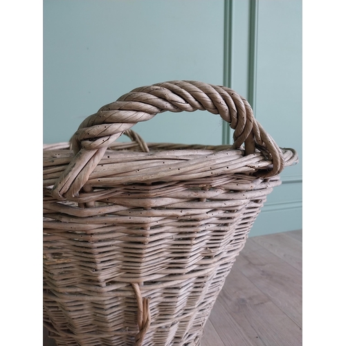 255 - Two early 20th C. wicker baskets {40 cm H x 50 cm W x 48 cm D and 47 cm H x 67 cm W x 54 cm D}.