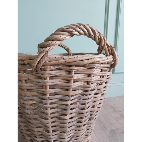 255 - Two early 20th C. wicker baskets {40 cm H x 50 cm W x 48 cm D and 47 cm H x 67 cm W x 54 cm D}.