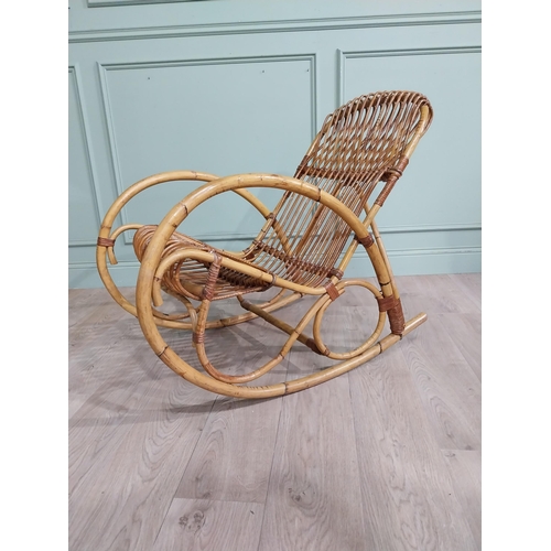 10 - Mid century bamboo rocking chair. {83 cm H x 57 cm W x 100 cm D}.