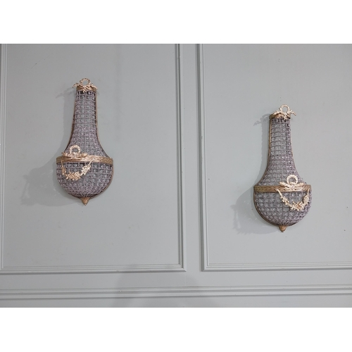 104 - Pair of French brass and crystal glass pear drop wall lights. {68 cm H x 28 cm W x 18 cm D}.