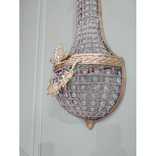 104 - Pair of French brass and crystal glass pear drop wall lights. {68 cm H x 28 cm W x 18 cm D}.