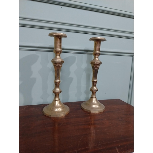 121 - Pair of brass candlesticks in the Victorian style. {28 cm H x 12 cm Dia.}.