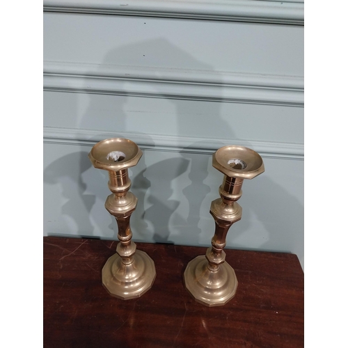 121 - Pair of brass candlesticks in the Victorian style. {28 cm H x 12 cm Dia.}.