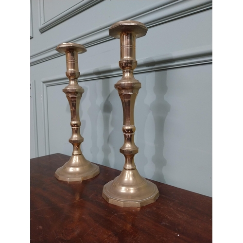 121 - Pair of brass candlesticks in the Victorian style. {28 cm H x 12 cm Dia.}.