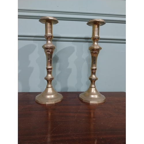 121 - Pair of brass candlesticks in the Victorian style. {28 cm H x 12 cm Dia.}.